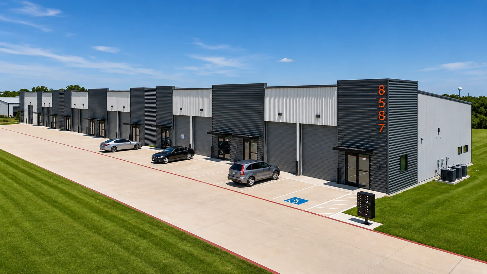 Fusion Business Park at 8587 Stewart Rd, Aubrey, TX 76227: a row of flex suites with finished front offices and grade-level overhead warehouse doors.